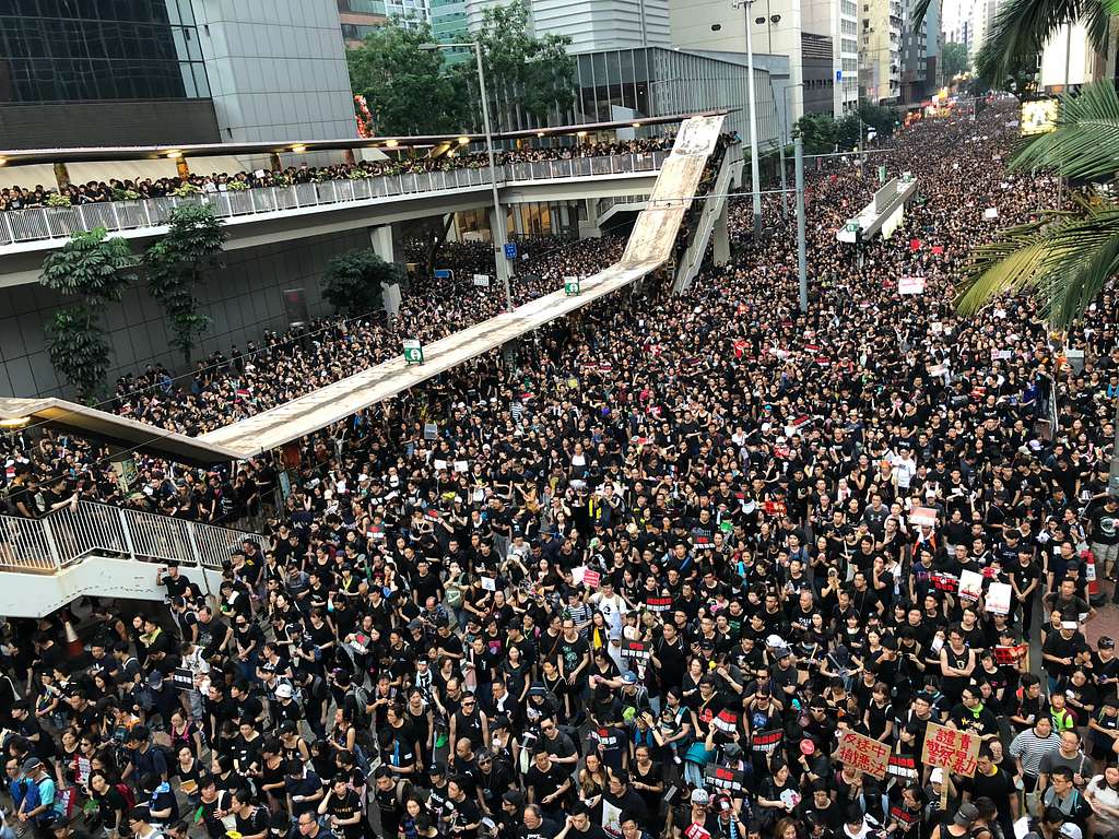Protesters in black in Hong Kong, large amount of people forces police to open up more roads.